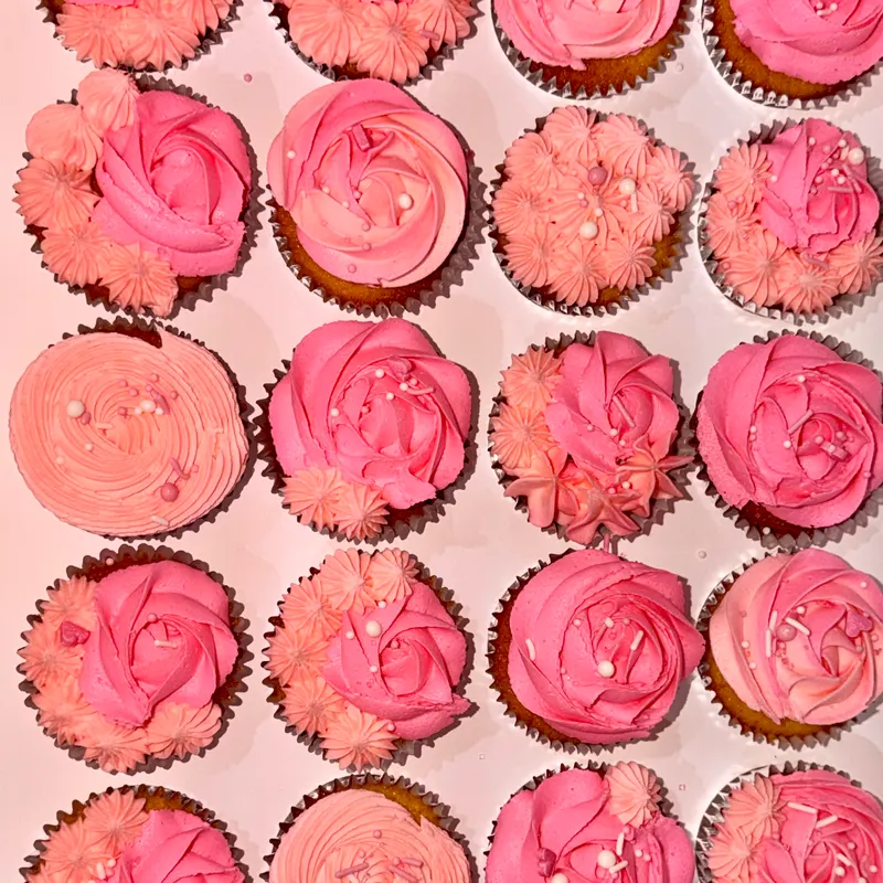 Rose-swirl cupcakes handmade by Crumbs & Cream